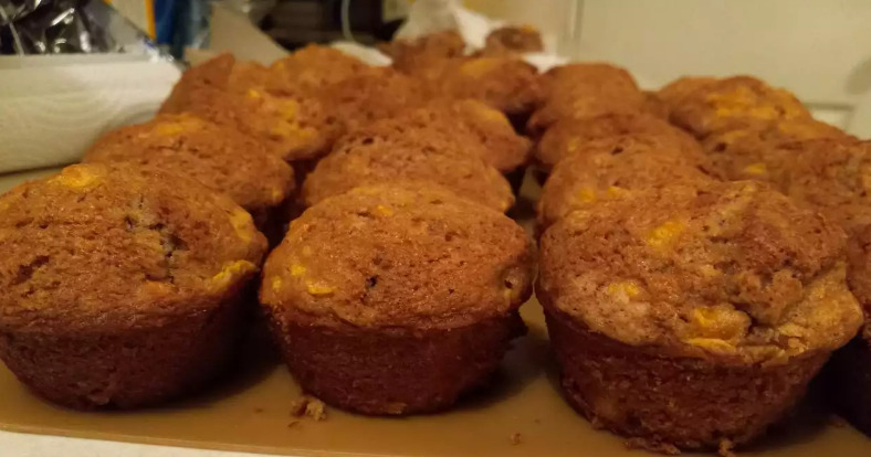 Healthy apple carrot muffins cooling on a rack